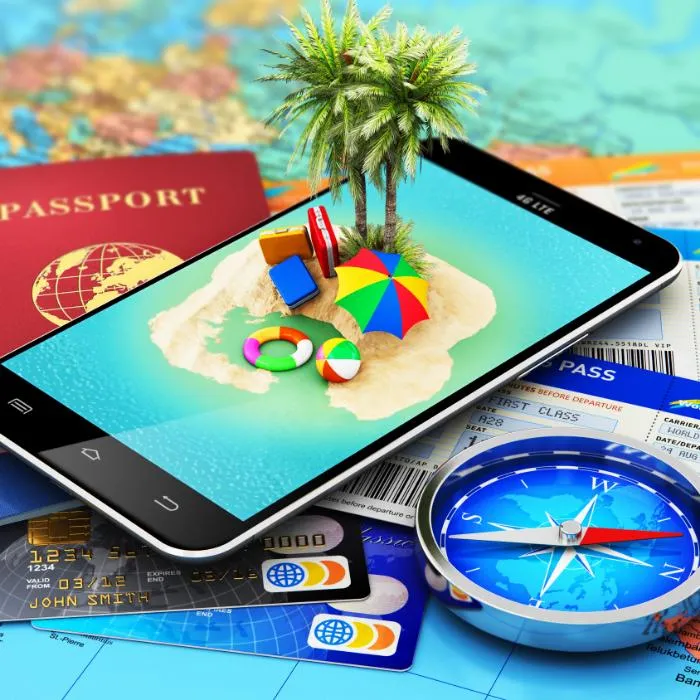 A creative travel concept with a smartphone displaying a miniature tropical island, surrounded by a passport, boarding pass, and credit cards—symbolizing dental tourism and digital travel booking.