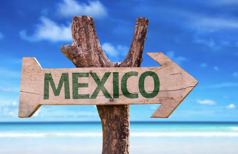 A rustic wooden signpost with the word 